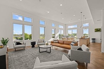 Boise apartment for rent - a living room with couches and chairs and large windows