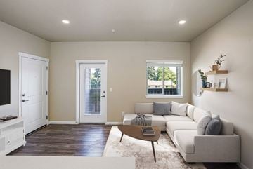 Salem apartment for rent - A living room with a white couch and a wooden coffee table.