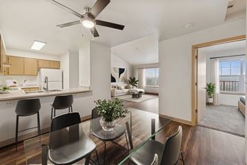 Eugene apartment for rent - A modern kitchen with a dining table and chairs.