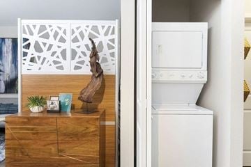 San Diego apartment for rent - A white oven is in a kitchen next to a wooden dresser.