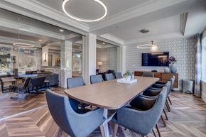 Bellevue apartment for rent - Lux Apartments Bellevue WA conference room with large meeting table and TV for small gatherings like business presentations or game night