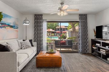 Phoenix apartment for rent - a living room with a couch and a coffee table in front of a patio door