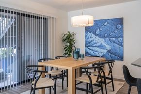 Bellevue apartment for rent - A dining room with a wooden table and chairs.