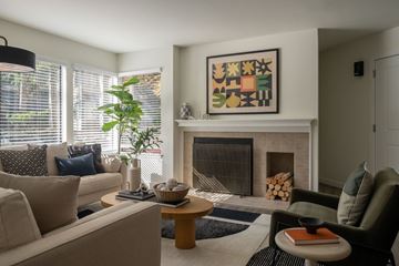 Bellevue apartment for rent - A living room with a fireplace and a painting above it.