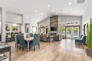 Moses Lake apartment for rent - a living room with a table and chairs and a fireplace