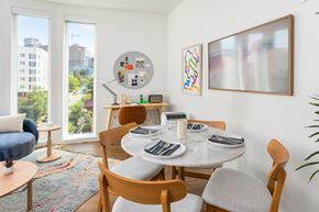 Seattle apartment for rent - A dining room with a white table and chairs.