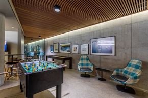 Portland apartment for rent - a game room with a foosball table and chairs