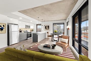 Portland apartment for rent - A modern living room with a green sofa and a coffee table.