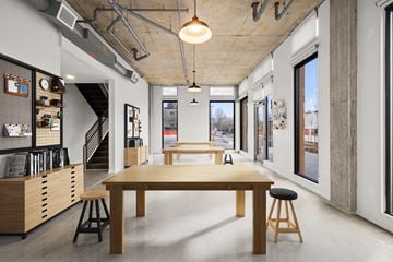 Portland apartment for rent - A modern room with a long table and stools.