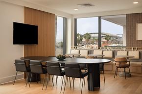 Phoenix apartment for rent - A modern dining room with a large table and chairs.