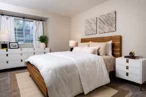 Silverdale apartment for rent - an example of a bedroom with a large bed and a window