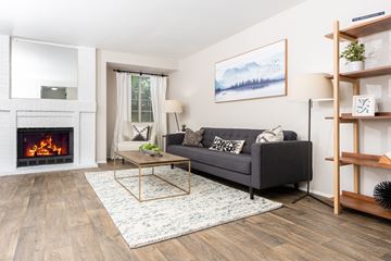 Silverdale apartment for rent - a living room with a fireplace and a couch