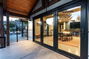 Silverdale apartment for rent - a patio with sliding glass doors and a dining area with a table and chairs