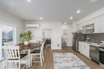 Wenatchee apartment for rent - A modern kitchen with a dining table and chairs.