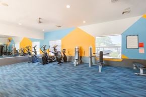 Tucson apartment for rent - A gym with a variety of exercise equipment.