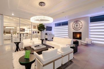 Bluffdale apartment for rent - a living room with white furniture and a clock on the wall