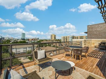 Breathtaking rooftop indoor-outdoor lounge with wet bar