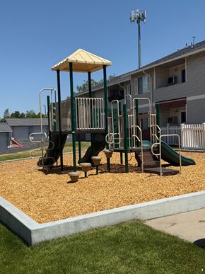 Layton apartment for rent - A playground with a yellow canopy and a green slide.