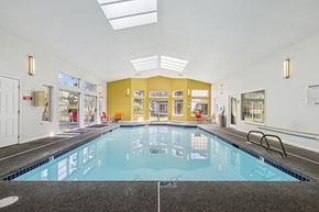 Everett apartment for rent - A large indoor swimming pool with a tiled floor. at Saratoga, Everett, WA, 98204