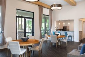Olathe apartment for rent - A modern dining room with a round table and chairs.