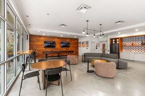 Bellevue apartment for rent - A modern dining area with a wooden table and chairs.