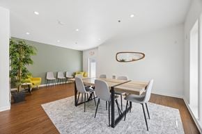 Gresham apartment for rent - Community clubhouse long dining table with seating at Springwater Crossing apartments in Gresham, Oregon 97030