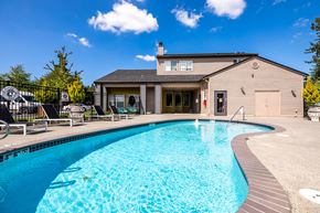 Everett apartment for rent - A swimming pool in front of a house.