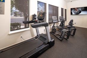 Salt Lake City apartment for rent - A gym with treadmills and exercise bikes.