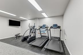Walla Walla apartment for rent - A gym with treadmills, elliptical machines, and a bench.