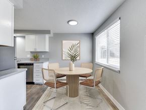 Vancouver apartment for rent - A dining room with a round table and chairs.