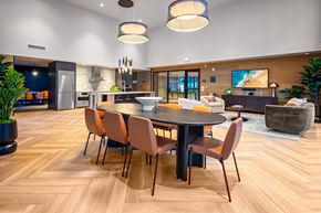 Shoreline apartment for rent - A modern dining room with a large table and chairs.