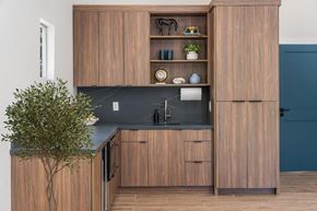 Flagstaff apartment for rent - A kitchen with wooden cabinets and a black countertop.