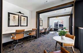 Celina apartment for rent - A conference room with a table, chairs, and framed pictures on the wall.