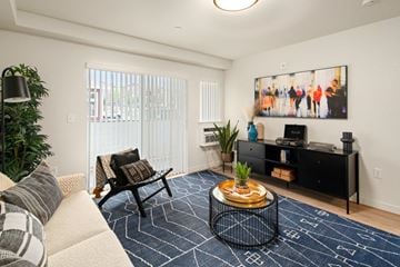 Olympia apartment for rent - a living room with a couch and a table