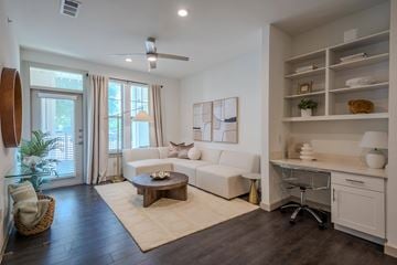 Midlothian apartment for rent - A living room with a white couch and a wooden coffee table.