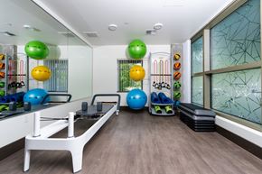 Bothell apartment for rent - A gym with exercise balls and a rowing machine.