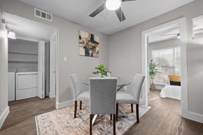 Dallas apartment for rent - A dining room with a table and chairs.