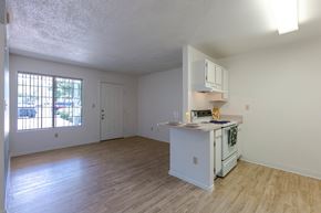Sierra Vista apartment for rent - A kitchen with white cabinets and a wooden floor.