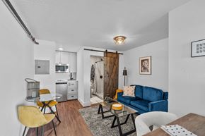 Boise apartment for rent - The Prospect Apartments Model Living Room with Kitchen and Bathroom