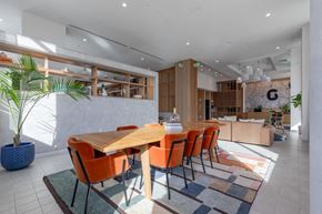 Hyattsville apartment for rent - A dining room with a wooden table and orange chairs.