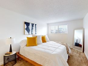 Kennewick apartment for rent - a bedroom with a large bed and a mirror