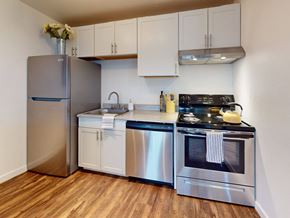 Kennewick apartment for rent - a kitchen with stainless steel appliances and a refrigerator