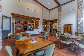 Houston apartment for rent - A dining room with a wooden table surrounded by chairs.