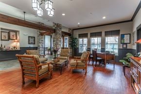 Houston apartment for rent - A living room with wooden floors and furniture.