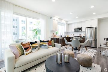 Los Angeles apartment for rent - A modern living room with a white sofa and a black coffee table.