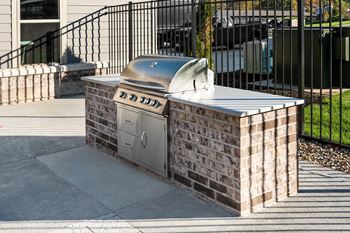 Outdoor grill area with fire pit