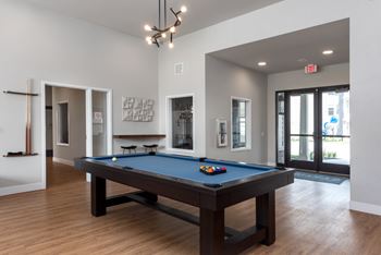 Spacious clubhouse with pool table, tv's, fireplace & conversational seating