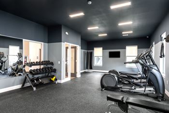 24/7 Modern fitness center with cardio and free weights