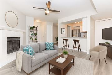 Fort Worth apartment for rent - A living room with a grey couch and a coffee table.