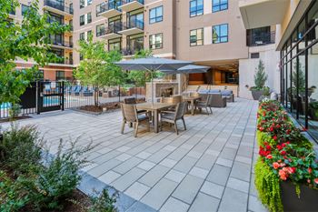 Outdoor courtyard with lounge seating and fire place